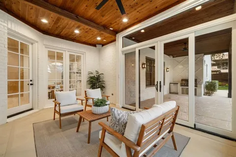 a dining room with furniture and front door