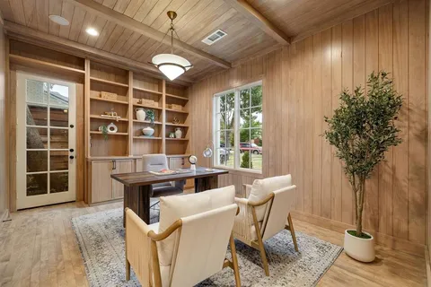 a view of a dining room with furniture window and outside view