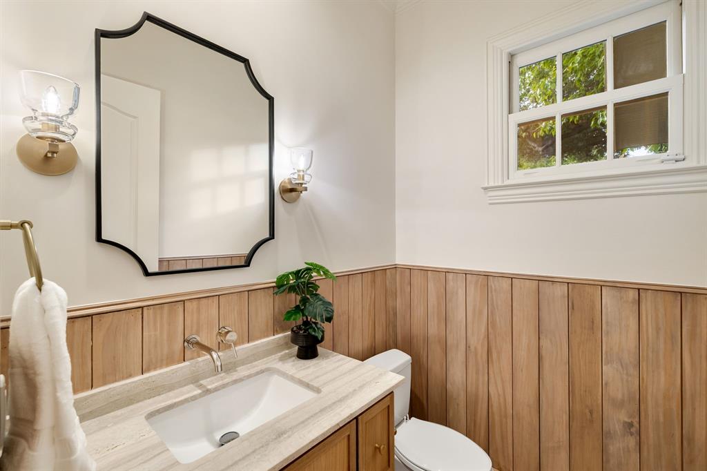 6411 Orchid Lane Dallas, TX 75230 - Photo 8 of 40 a bathroom with a sink vanity mirror and toilet