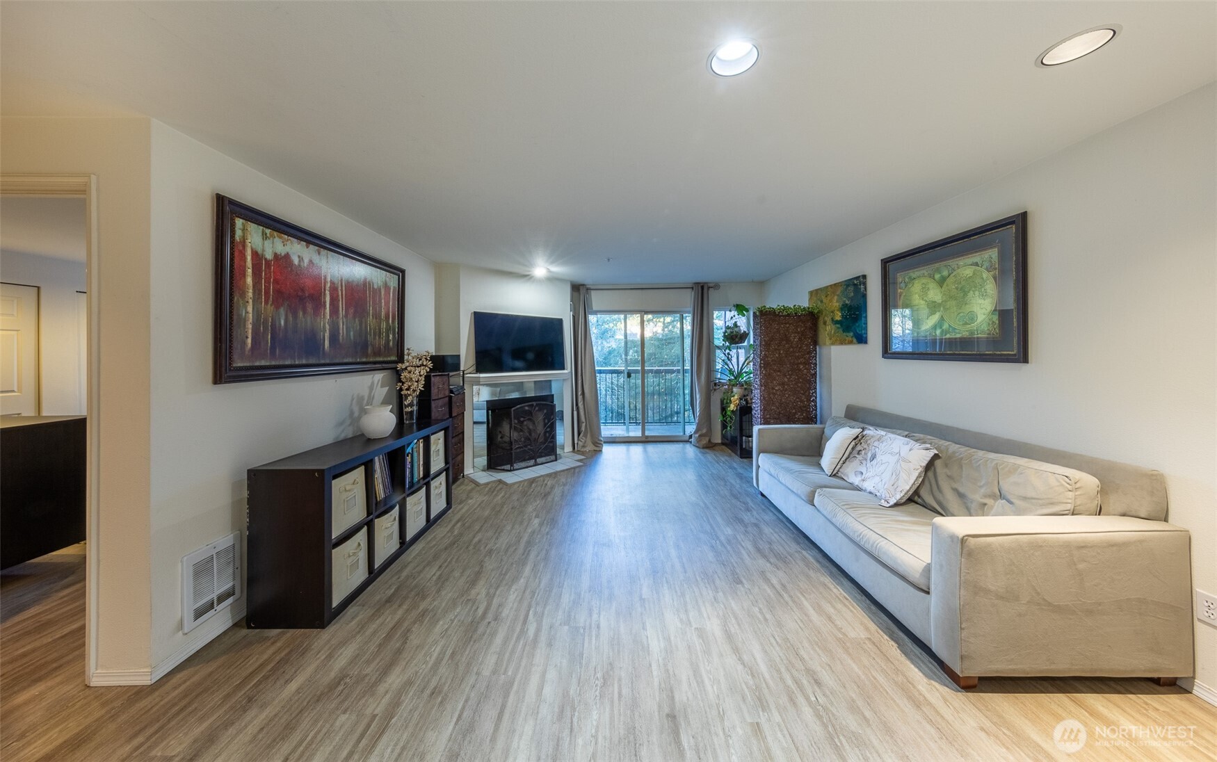 15917 Waynita Way Northeast, Unit E206 Bothell, WA 98011 - Photo 11 of 27 a living room with furniture and a flat screen tv