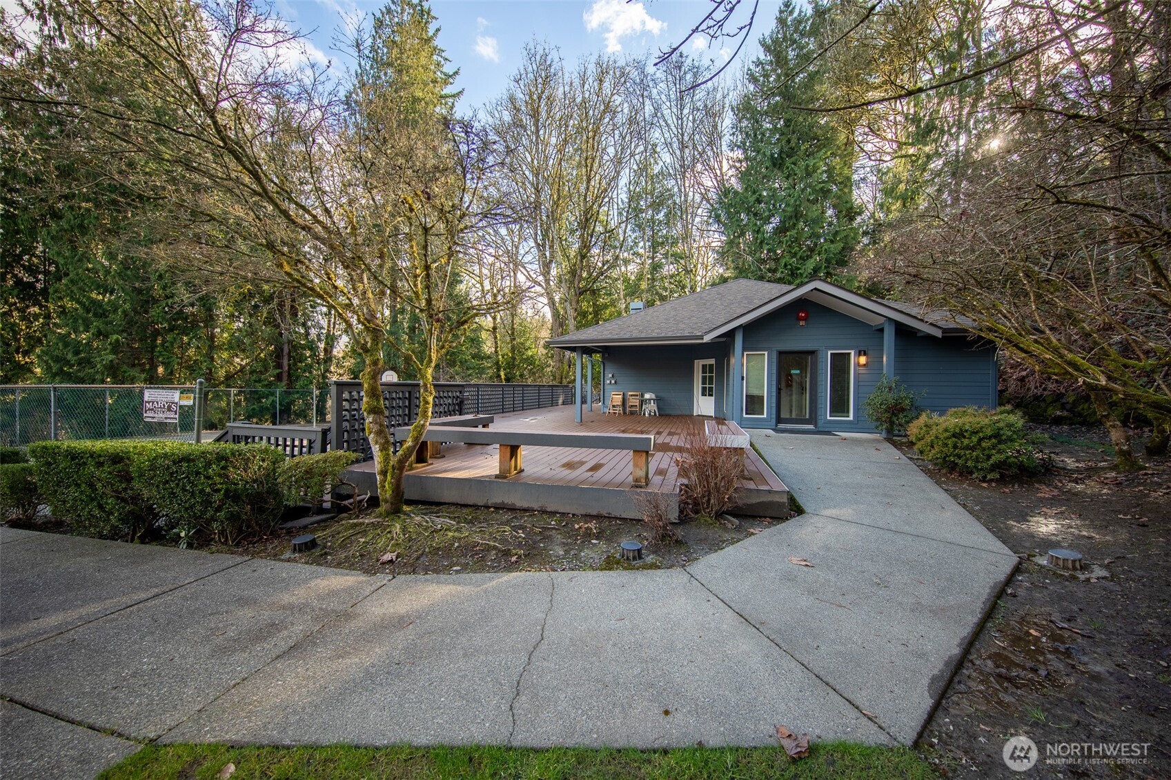 15917 Waynita Way Northeast, Unit E206 Bothell, WA 98011 - Photo 23 of 27 a front view of a house with a garden