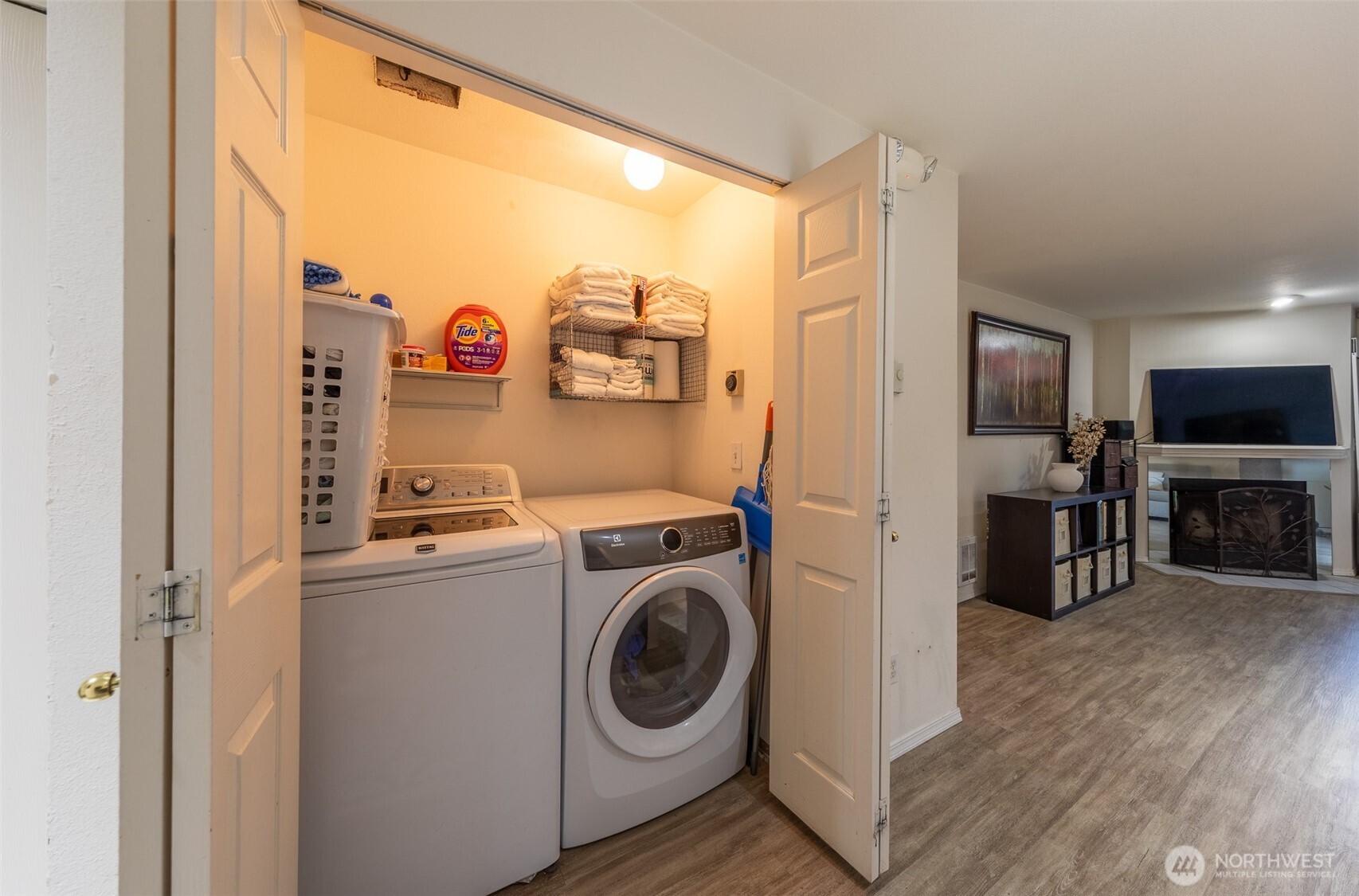 15917 Waynita Way Northeast, Unit E206 Bothell, WA 98011 - Photo 7 of 27 a view of a kitchen with fridge and wooden floor