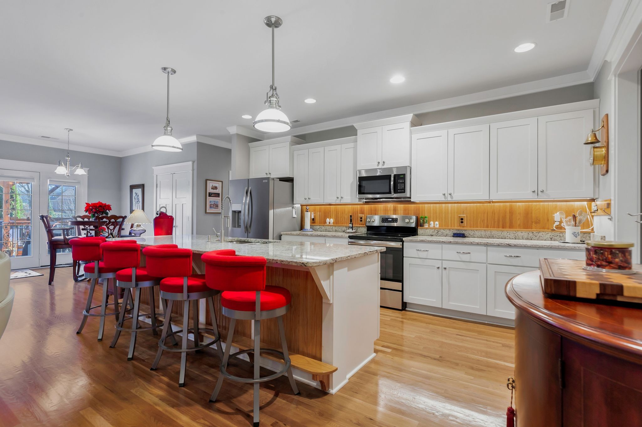 3043 Crossgate Lane Columbia, TN 38401 - Photo 15 of 45 a kitchen with kitchen island granite countertop a dining table chairs sink and white cabinets