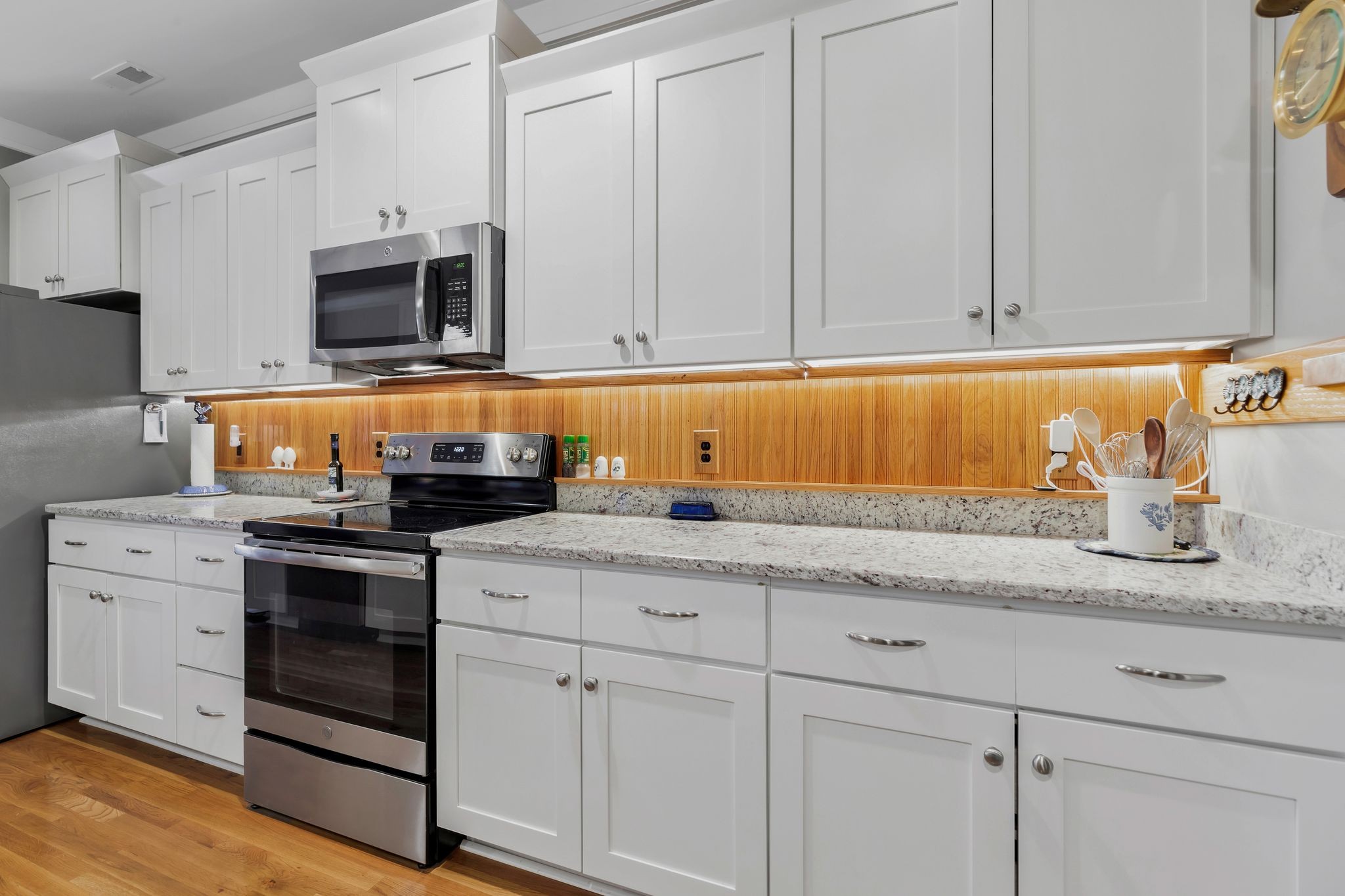 3043 Crossgate Lane Columbia, TN 38401 - Photo 19 of 45 a kitchen with stainless steel appliances granite countertop white cabinets stove a sink and dishwasher