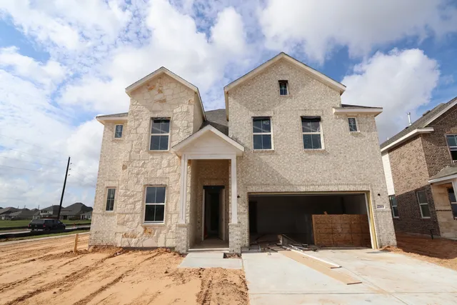 a front view of a house with yard