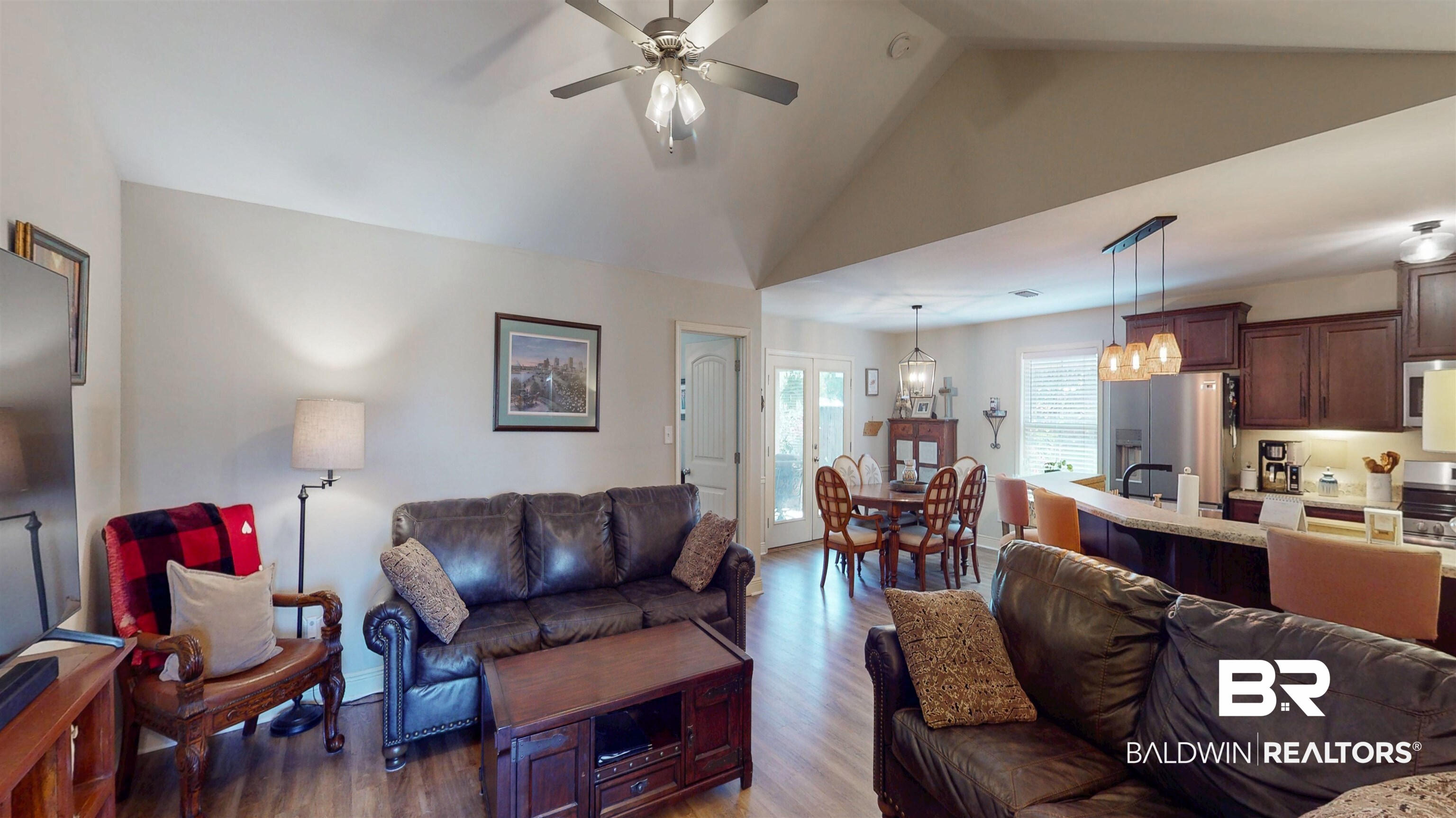 1304 Majesty Loop Foley, AL 36535 - Photo 2 of 44 Living room featuring dark wood-style flooring, a ceiling fan, a high ceiling, and hanging lights