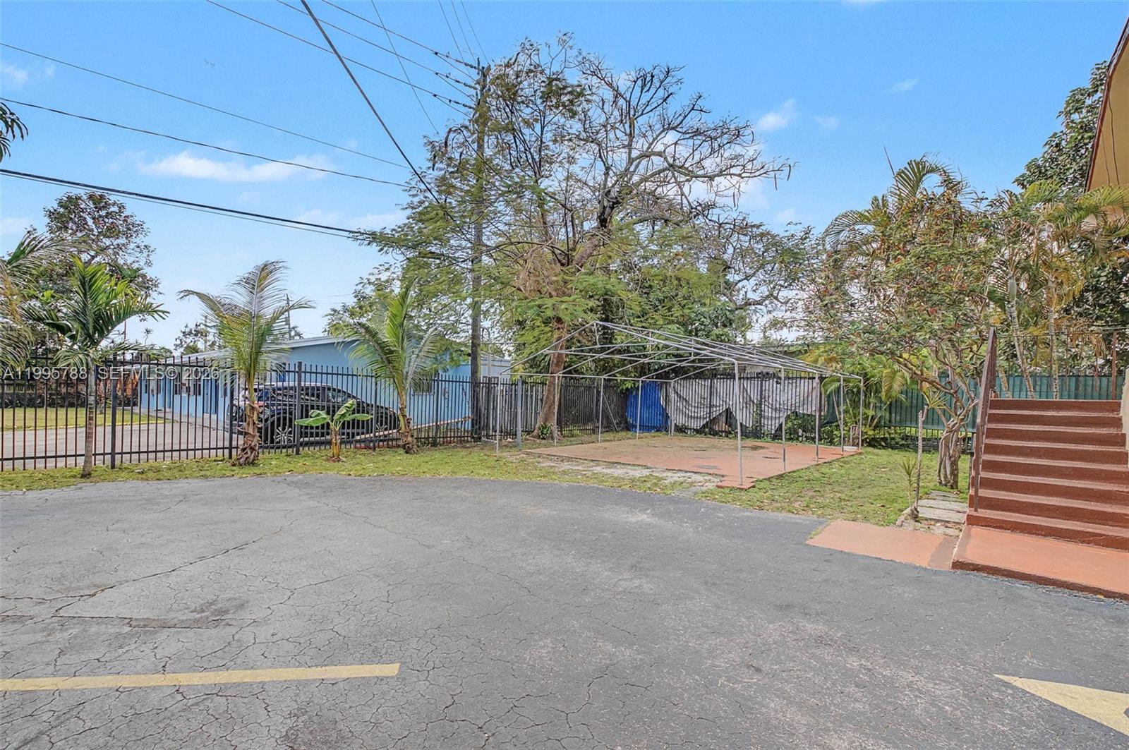 60 Northwest 79th Street, Unit 23 Miami, FL 33150 - Photo 17 of 23 a view of a street with houses on both side of it