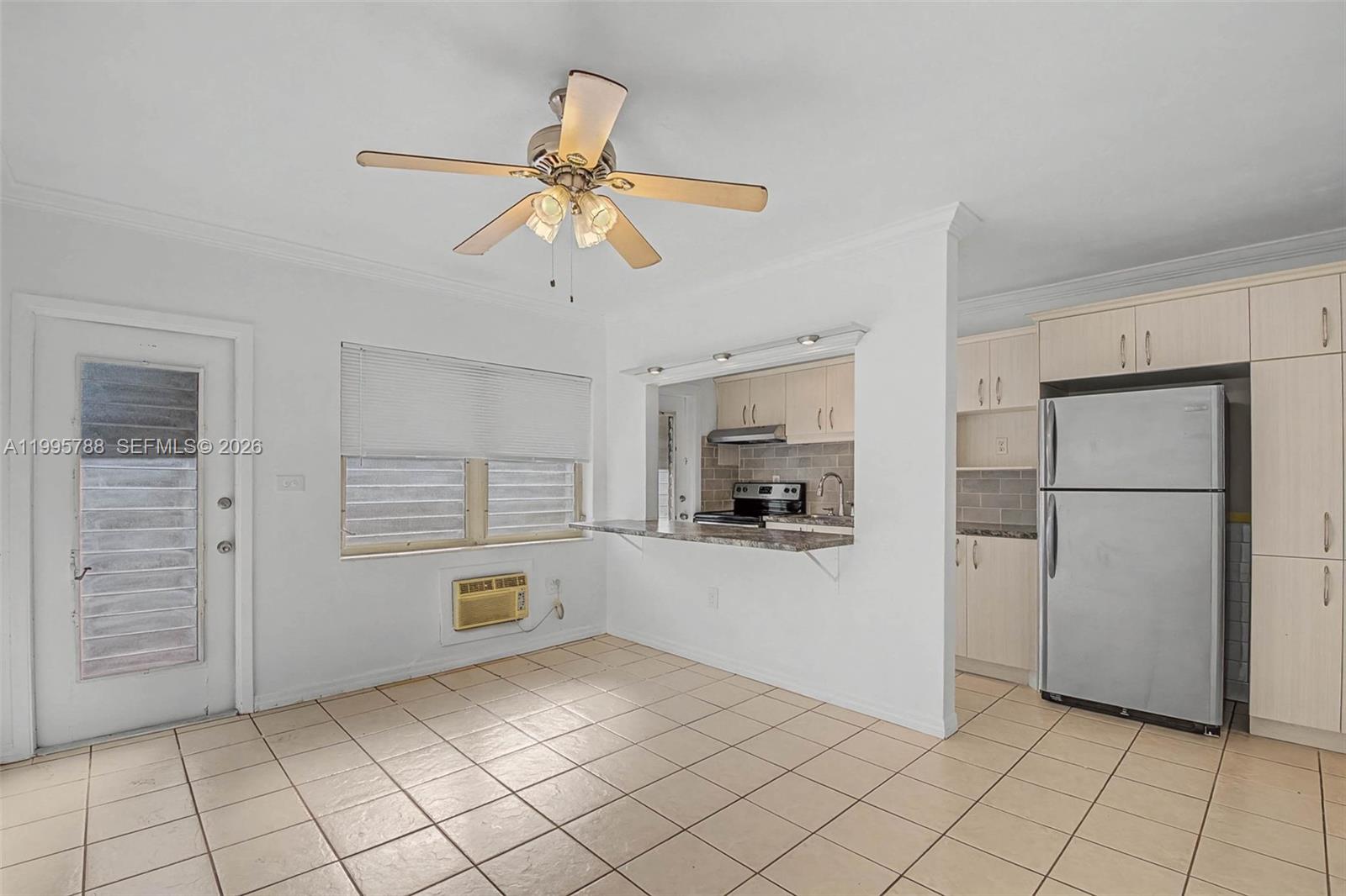 60 Northwest 79th Street, Unit 23 Miami, FL 33150 - Photo 23 of 23 a kitchen with white cabinets and appliances