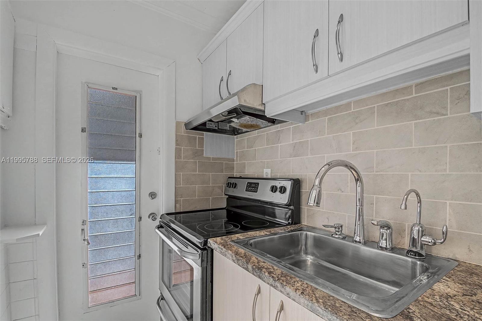 60 Northwest 79th Street, Unit 23 Miami, FL 33150 - Photo 3 of 23 a close view of sink and tap