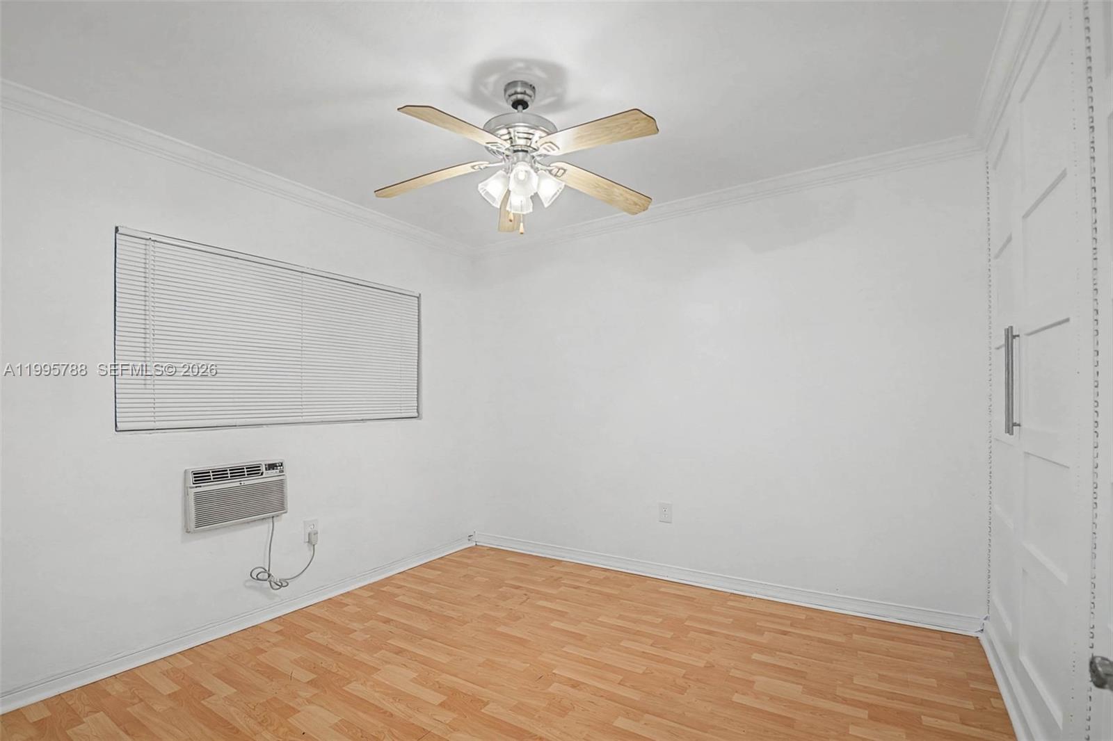 60 Northwest 79th Street, Unit 23 Miami, FL 33150 - Photo 6 of 23 a view of a livingroom with a fan