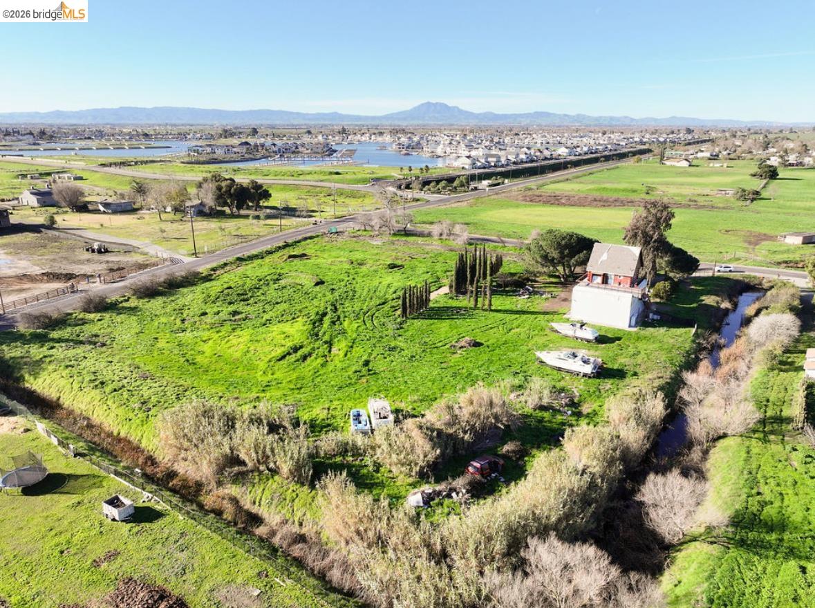 5980 Piper Road Bethel Island, CA 94511 - Photo 13 of 24 Aerial view of sparsely populated area with a water and mountain view