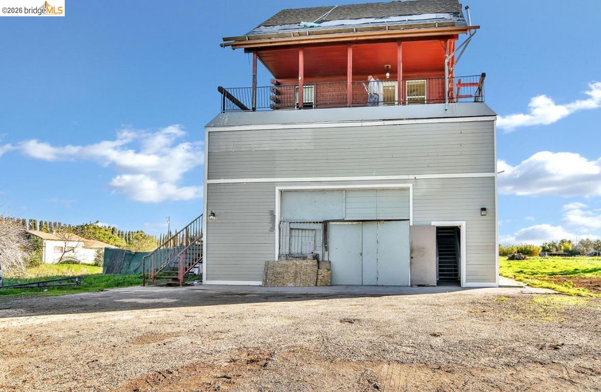 5980 Piper Road Bethel Island, CA 94511 - Photo 14 of 24 Rear view of property featuring a balcony and stairs