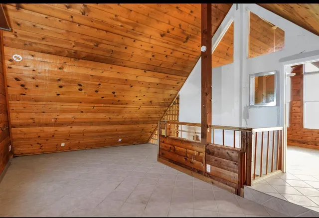 a view of a balcony with hardwood