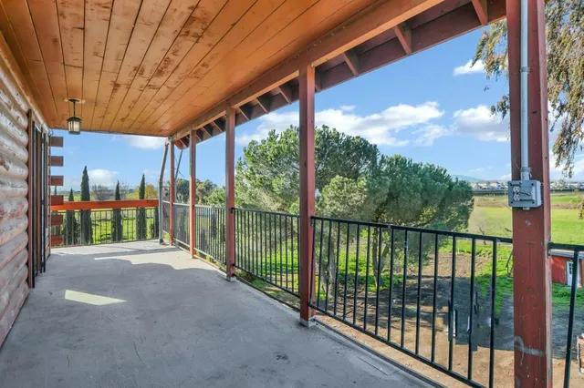 a view of a street view from a balcony