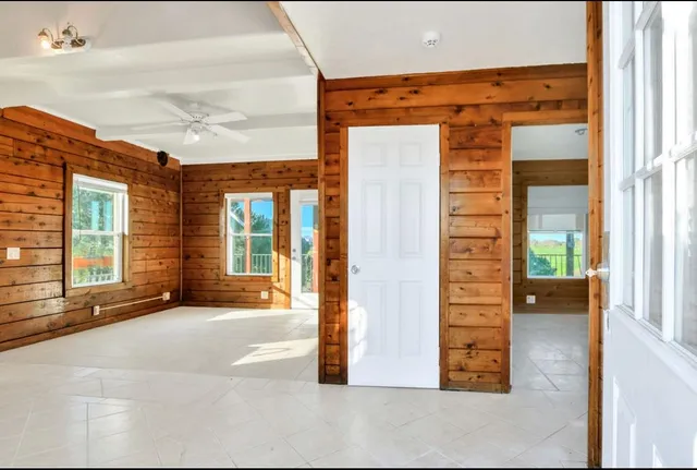 a view of a brick house with a large window