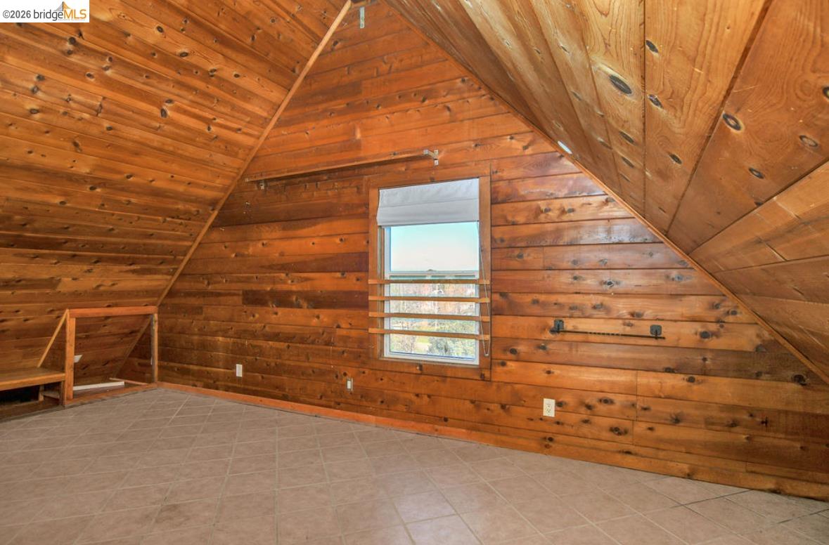 5980 Piper Road Bethel Island, CA 94511 - Photo 10 of 24 Additional living space featuring wood ceiling, lofted ceiling, and wood walls