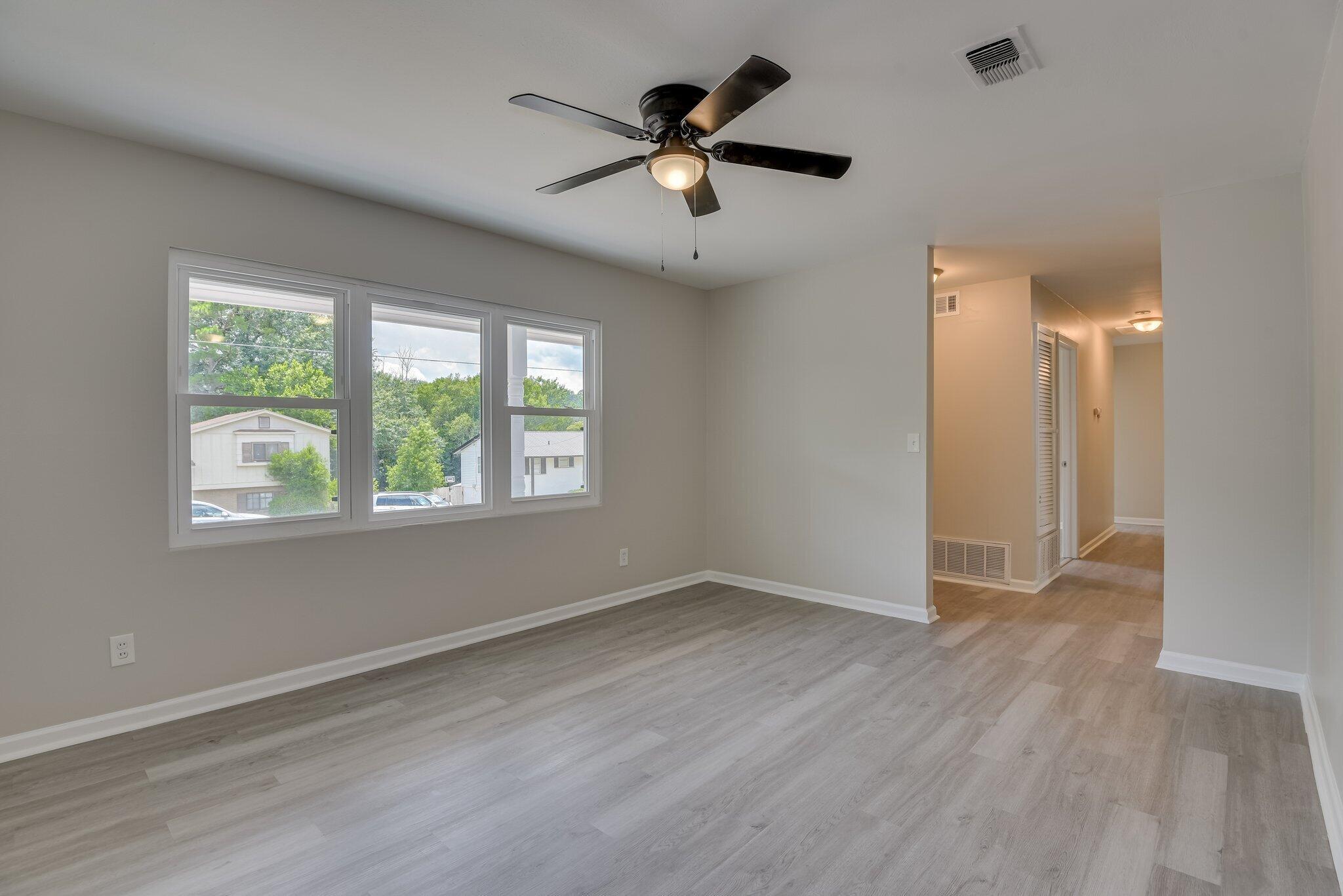 2115 Ashley Drive Augusta, GA 30906 - Photo 7 of 38 wooden floor in an empty room with a window