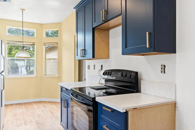 a kitchen with a stove and a microwave