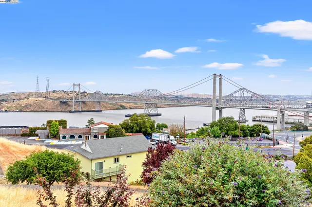 a view of a lake with couches and city view