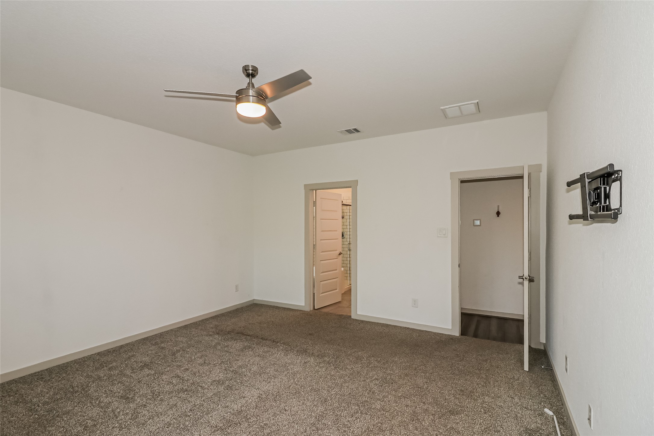 7322 Ramsgate Cliff Lane Richmond, TX 77407 - Photo 11 of 17 an empty room with closet and windows