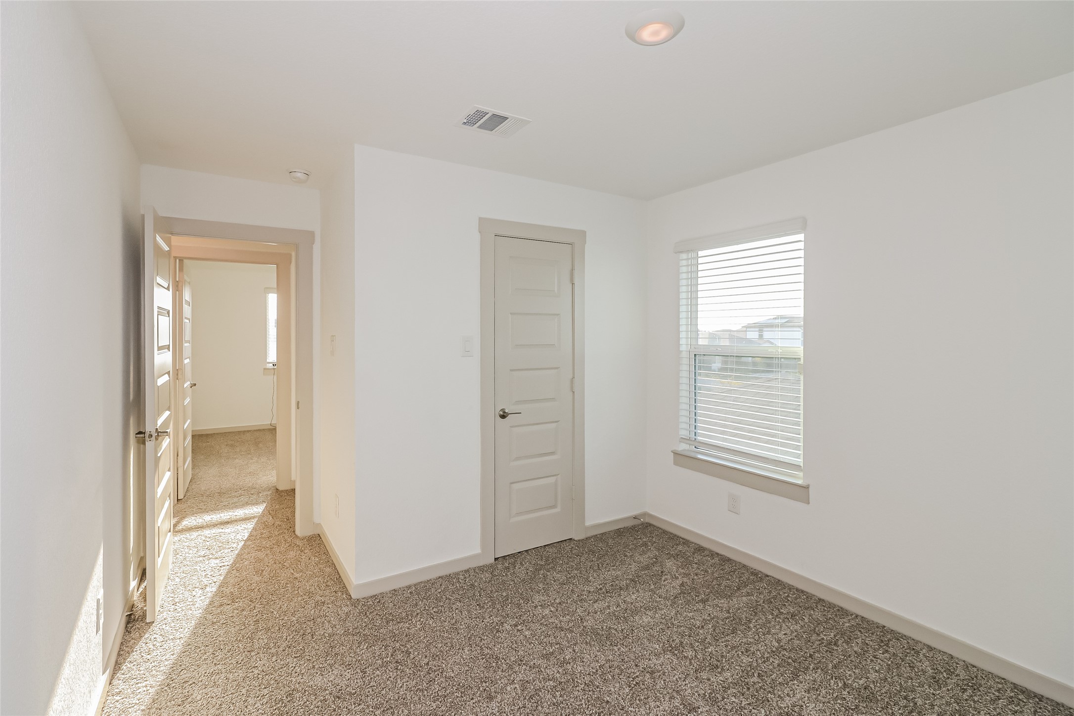 7322 Ramsgate Cliff Lane Richmond, TX 77407 - Photo 16 of 17 an empty room with windows and bathroom view