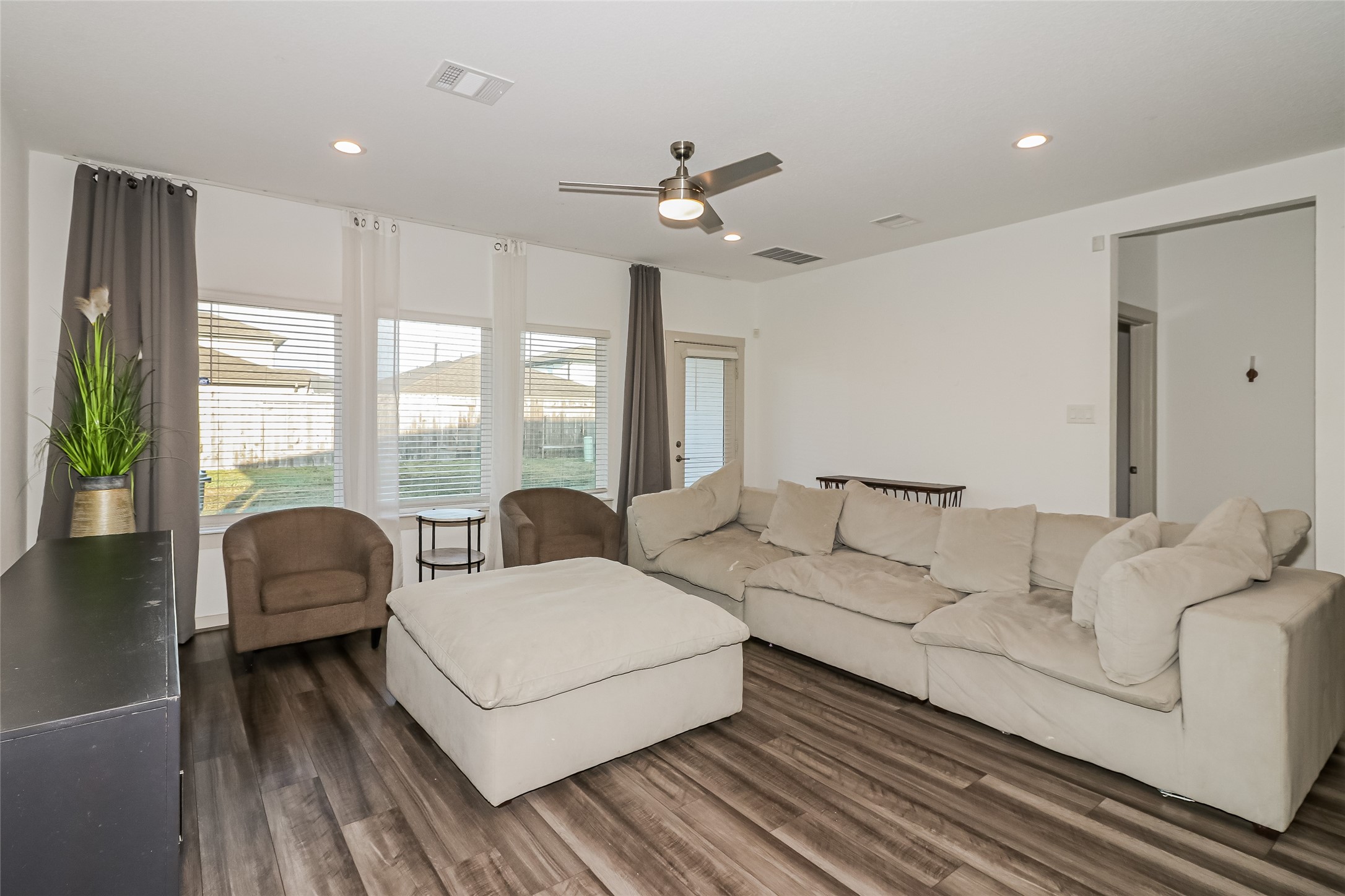 7322 Ramsgate Cliff Lane Richmond, TX 77407 - Photo 5 of 17 a living room with furniture and a large window