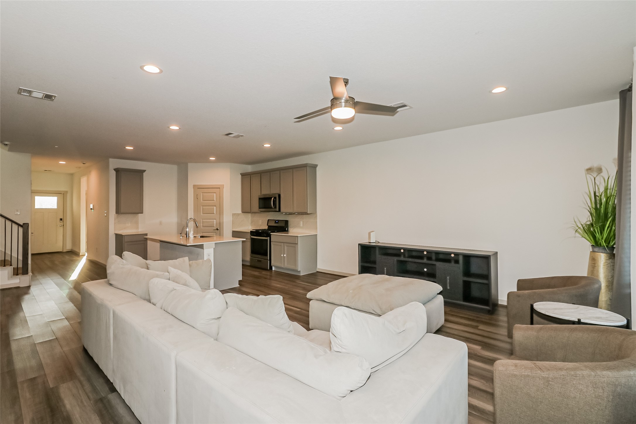 7322 Ramsgate Cliff Lane Richmond, TX 77407 - Photo 6 of 17 a living room with furniture and a fireplace