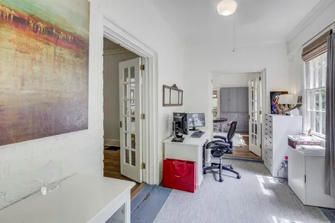 a view of a workspace with furniture and workspace