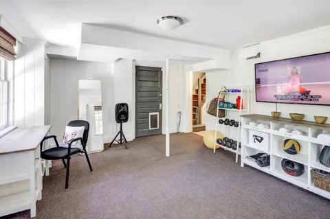 a view of a livingroom with furniture and toys