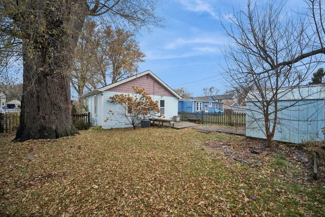 a view of a house with a yard covered in snow
