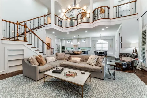 a living room with furniture ceiling fan and a rug