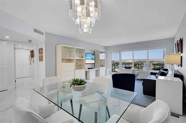 a kitchen with cabinets stainless steel appliances and sink