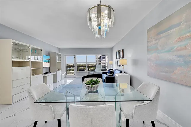 a kitchen with white cabinets and refrigerator