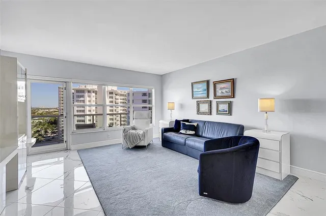 a large white kitchen with cabinets and stainless steel appliances