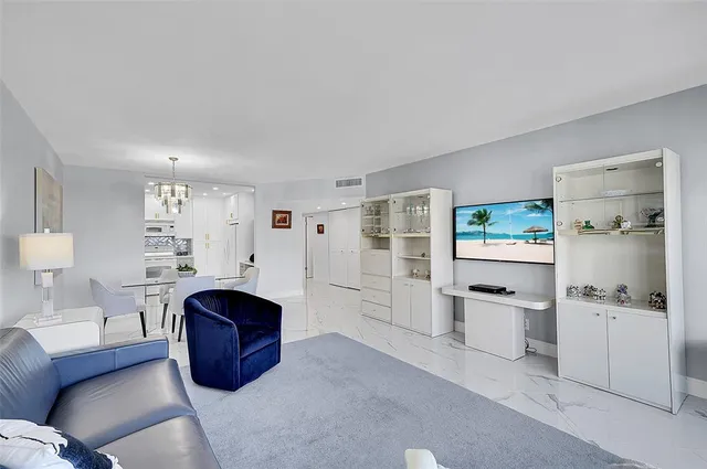 a spacious bedroom with a bed and a couch