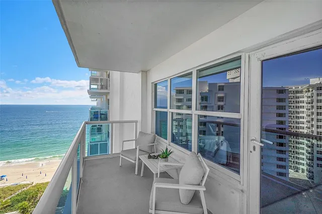 a bathroom with a granite countertop sink a mirror a shower and a bathtub