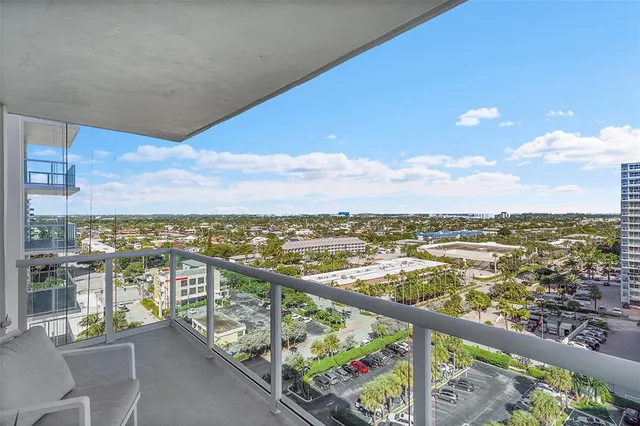 a bathroom with a sink vanity granite tub shower and a mirror