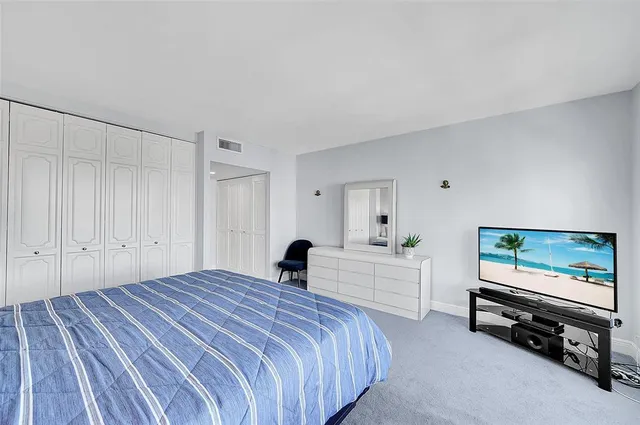 a lobby with furniture and a table