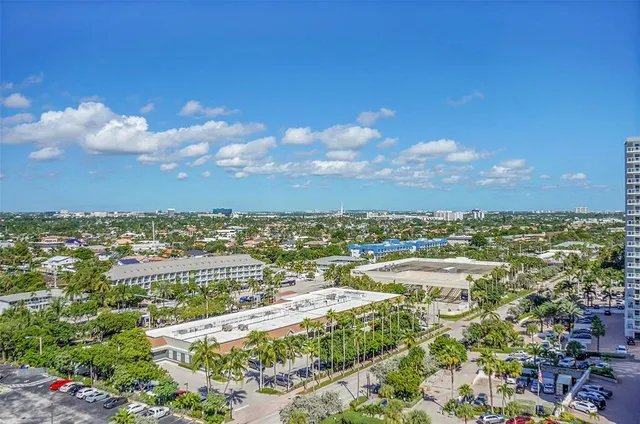 a view of buildings with yard