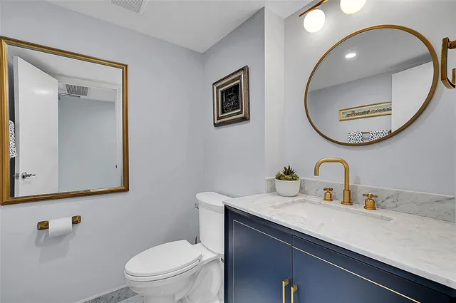 a view of a dining room with furniture wooden floor and a chandelier