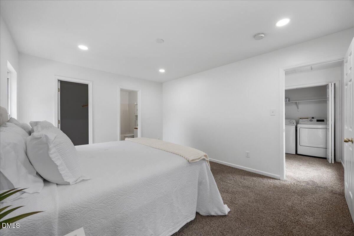 3831 Pin Oak Road Raleigh, NC 27604 - Photo 13 of 24 a spacious bedroom with a bed and a view