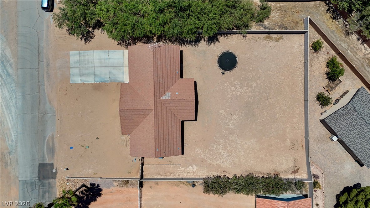 1272 Liston Avenue Logandale, NV 89021 - Photo 52 of 61 An aerial perspective showcases a spacious lot with a single-story residence and a defined concrete slab.
