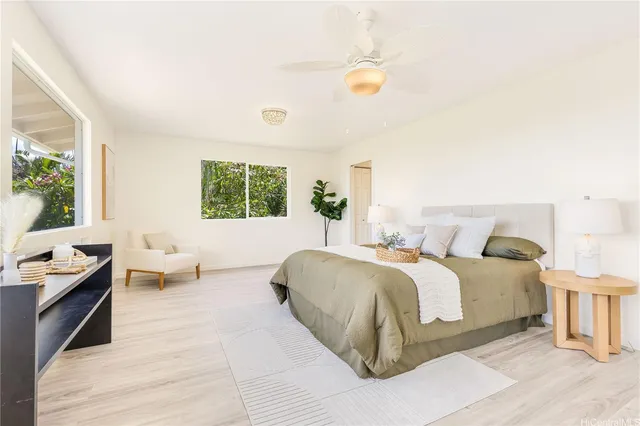 a spacious bedroom with a bed and a couch