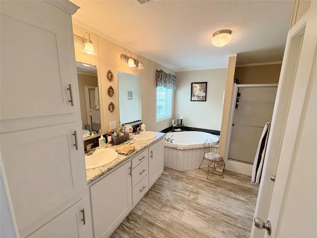 a bathroom with a double vanity sink mirror double and toilet