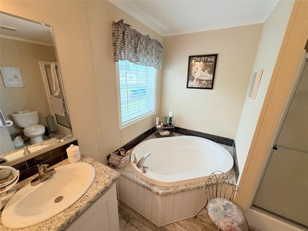 4331 Southwest 10th Way Okeechobee, FL 34974 - Photo 18 of 49 a bathroom with a sink toilet and a mirror