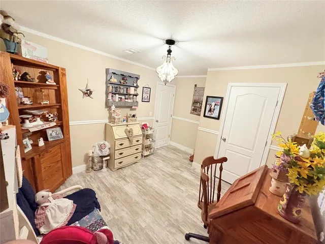 a living room with furniture a rug and a window