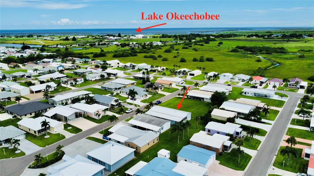 4331 Southwest 10th Way Okeechobee, FL 34974 - Photo 2 of 49 a view of a bunch of flowers in front of building