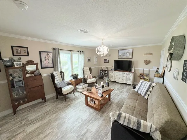 a living room with furniture or couch and a flat screen tv
