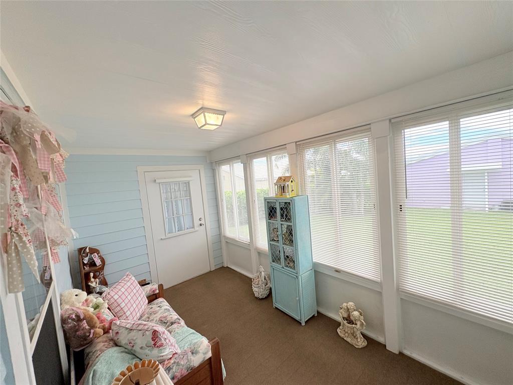 4331 Southwest 10th Way Okeechobee, FL 34974 - Photo 27 of 49 a bedroom with furniture and a large window