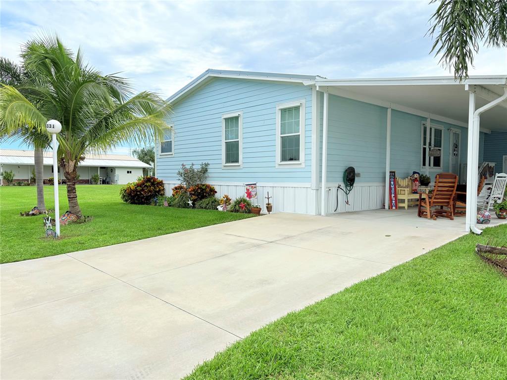 4331 Southwest 10th Way Okeechobee, FL 34974 - Photo 37 of 49 a front view of house with yard and green space